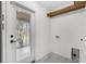Clean laundry room with white walls, gray floors, and stainless steel appliances at 714 28Th St, Orlando, FL 32805