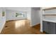 Bright living room with hardwood floors, white walls, and natural light from a large window at 714 28Th St, Orlando, FL 32805