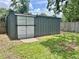 Durable storage shed with sliding doors, perfect for storing outdoor equipment and tools at 714 28Th St, Orlando, FL 32805