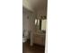 Bathroom featuring a single sink vanity and a mirrored medicine cabinet at 7350 Westpointe Blvd # 234, Orlando, FL 32835