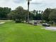 Community entrance with landscaped grounds and access gate at 7350 Westpointe Blvd # 234, Orlando, FL 32835