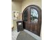 Front door entrance with dark wood decorative double doors at 7350 Westpointe Blvd # 234, Orlando, FL 32835