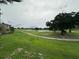 Picturesque golf course view with lush green grass and a pond at 7350 Westpointe Blvd # 234, Orlando, FL 32835