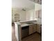 Kitchen view with light cabinets, laminate counters, and stainless steel dishwasher at 7350 Westpointe Blvd # 234, Orlando, FL 32835