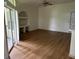 Spacious living room with wood floors, recessed lighting, and built-in shelves at 7350 Westpointe Blvd # 234, Orlando, FL 32835