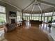 Community lounge area with hardwood floors, fireplace, TV, and comfortable seating at 7350 Westpointe Blvd # 234, Orlando, FL 32835
