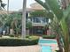Community pool area with lush greenery and lounge chairs at 7350 Westpointe Blvd # 234, Orlando, FL 32835