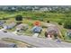 Aerial shot displays a lovely neighborhood and the home's proximity to nearby wooded areas at 7744 Country Run Pkwy, Orlando, FL 32818