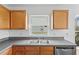 The kitchen features wood cabinets and modern appliances at 7744 Country Run Pkwy, Orlando, FL 32818