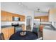 Eat-in kitchen features stainless appliances, light wood cabinets, and modern lighting at 7744 Country Run Pkwy, Orlando, FL 32818