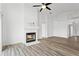 Cozy living room features a fireplace and modern wood flooring at 7744 Country Run Pkwy, Orlando, FL 32818