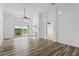 Living room features high ceilings, wood floors, fireplace, and sliding glass doors at 7744 Country Run Pkwy, Orlando, FL 32818