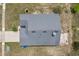Aerial view of a home featuring a well-maintained roof at 7744 Country Run Pkwy, Orlando, FL 32818