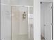 Walk-in shower featuring glass doors and tiled walls at 7744 Country Run Pkwy, Orlando, FL 32818
