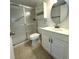 Bathroom features a shower, toilet, vanity, sink, mirror and storage at 8211 Sun Spring Cir # 11, Orlando, FL 32825