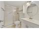 Bathroom featuring a shower with glass doors, vanity, and toilet at 8211 Sun Spring Cir # 11, Orlando, FL 32825