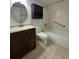 Bathroom boasts a tub, shower, vanity, sink, and storage at 8211 Sun Spring Cir # 11, Orlando, FL 32825