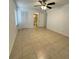 This bedroom has large tile floors, a ceiling fan, and a closet at 8211 Sun Spring Cir # 11, Orlando, FL 32825