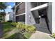 The building's exterior features lush landscaping that enhances its curb appeal and is a welcoming sight at 8211 Sun Spring Cir # 11, Orlando, FL 32825