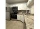 Kitchen with stainless steel appliances, granite countertops, and white cabinets at 8211 Sun Spring Cir # 11, Orlando, FL 32825