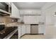 Well-equipped kitchen with stainless steel appliances, granite countertops, and stylish backsplash at 8211 Sun Spring Cir # 11, Orlando, FL 32825