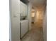 Hallway with stackable washer and dryer at 8211 Sun Spring Cir # 11, Orlando, FL 32825