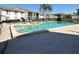 Community pool with lounge seating surrounded by lush landscaping at 8211 Sun Spring Cir # 11, Orlando, FL 32825