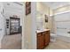 Bathroom with a tiled shower/tub, modern vanity, and an adjacent room at 8336 Sw 77Th Ct, Ocala, FL 34476