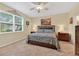 Bright bedroom with neutral walls, tile floors, and a large window that lets in natural light at 8336 Sw 77Th Ct, Ocala, FL 34476