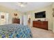Well lit bedroom featuring tile flooring, a closet, and attached bath at 8336 Sw 77Th Ct, Ocala, FL 34476