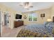Bedroom featuring a tile floor, a ceiling fan, closet and sliding door at 8336 Sw 77Th Ct, Ocala, FL 34476