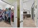 Organized walk-in closet with ample storage space and a door to the living space at 8336 Sw 77Th Ct, Ocala, FL 34476