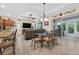 Bright dining area features elegant lighting and a glass table with seating for six at 8336 Sw 77Th Ct, Ocala, FL 34476
