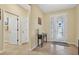 Bright foyer with tile flooring, a glass-paneled front door, and views to adjacent rooms at 8336 Sw 77Th Ct, Ocala, FL 34476