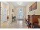 Inviting foyer with tile floors, a glass-accented front door, and warm neutral wall paint at 8336 Sw 77Th Ct, Ocala, FL 34476