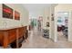 Inviting hallway with decorative art, leading to the dining area and other rooms of the home at 8336 Sw 77Th Ct, Ocala, FL 34476