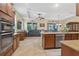 Open kitchen featuring granite countertops, stainless steel appliances, and view of the living area at 8336 Sw 77Th Ct, Ocala, FL 34476