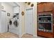 Clean and organized laundry room with modern washer and dryer, along with convenient built-in cabinets at 8336 Sw 77Th Ct, Ocala, FL 34476