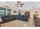 Open living space with a sectional couch and seamless transition to the kitchen and dining area at 8336 Sw 77Th Ct, Ocala, FL 34476