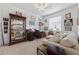Office features built-in display cabinet, desk, and comfortable couch at 8336 Sw 77Th Ct, Ocala, FL 34476