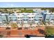 Stunning aerial view of new townhomes boasting modern design and vibrant community setting at 879 City Walk Ln, Oviedo, FL 32765