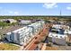 Wonderful aerial view showcasing a community filled with modern townhomes and retail at 879 City Walk Ln, Oviedo, FL 32765