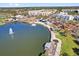 Aerial view of the lakefront community showing walking paths, community buildings and a fountain at 879 City Walk Ln, Oviedo, FL 32765
