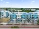 Gorgeous aerial view showcasing the townhouse building with unique color and a brick street at 879 City Walk Ln, Oviedo, FL 32765