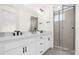 Clean bathroom featuring a double vanity and a glass-enclosed shower at 879 City Walk Ln, Oviedo, FL 32765