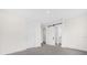 Spacious bedroom with a sliding barn door leading to the bathroom at 879 City Walk Ln, Oviedo, FL 32765