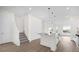 Bright kitchen features a central island with pendant lighting and modern fixtures at 879 City Walk Ln, Oviedo, FL 32765