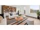 Bright living room featuring a built-in bookshelf and modern decor at 879 City Walk Ln, Oviedo, FL 32765