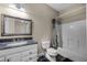 Well-lit bathroom featuring tiled floors and granite countertop vanity at 8814 Southern Breeze Dr, Orlando, FL 32836