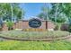 A picturesque stone and brick community sign with flowerbeds at 8814 Southern Breeze Dr, Orlando, FL 32836